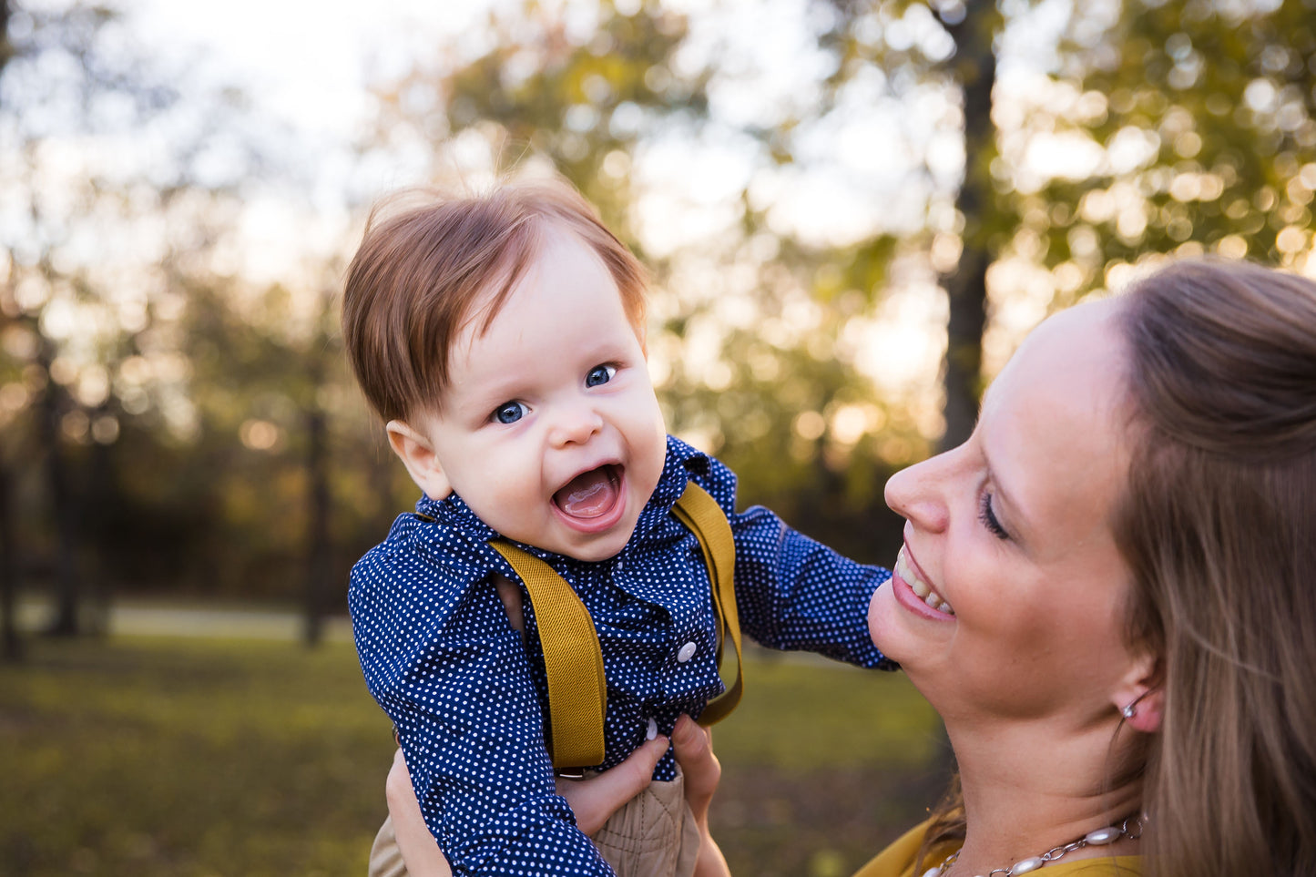 a woman holding a baby in her arms