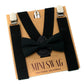 Black bow tie and suspenders on a cardboard box with 'Mini Swag' branding.