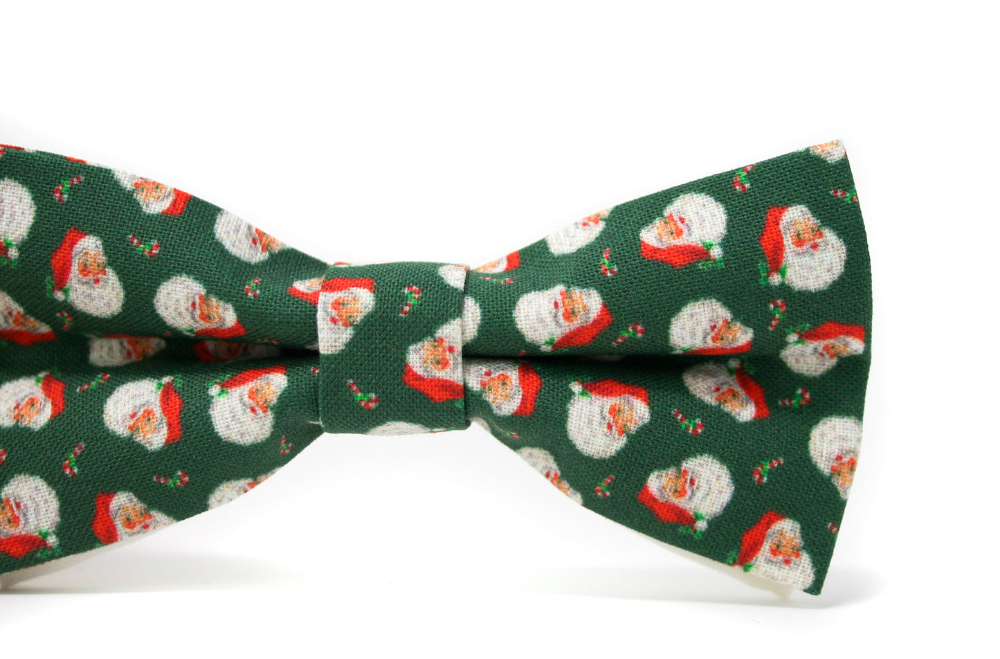 Green bow tie with vintage Santa Claus pattern on a white background