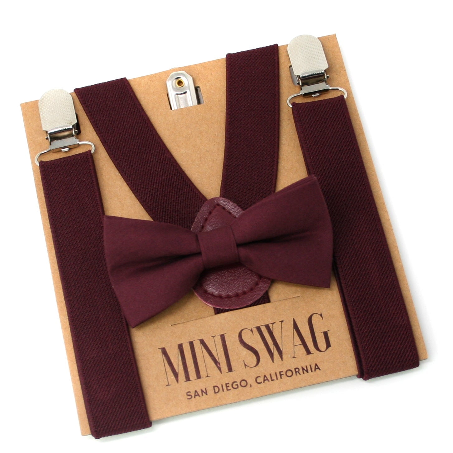 Maroon bow tie and suspenders set on a 'Mini Swag' branded box.