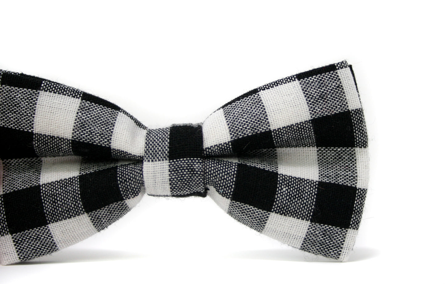 Black and white checkered bow tie on a white background