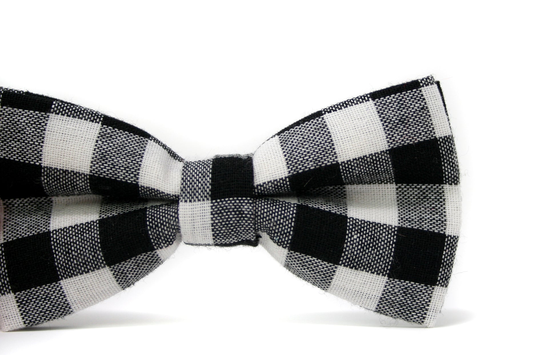 Black and white checkered bow tie on a white background