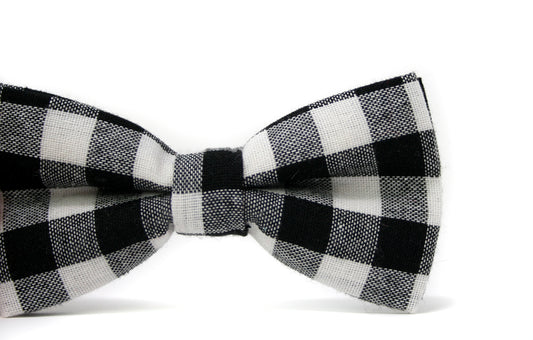 Black and white checkered bow tie on a white background