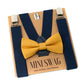 Navy suspenders with a Mustard  yellow bow tie on a Mini Swag branded card.