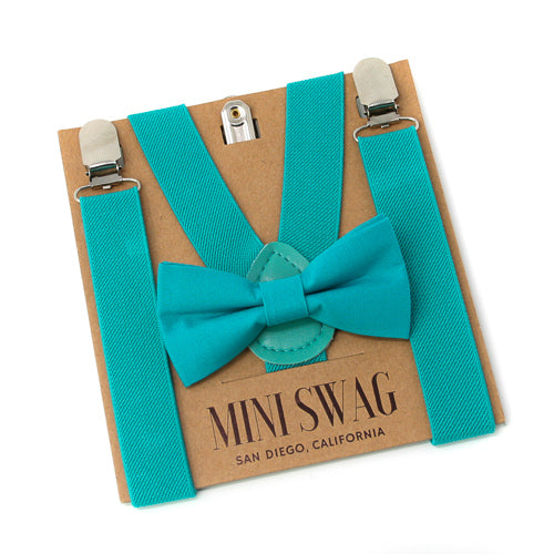 Turquoise suspenders and bow tie set on a Mini Swag branded card.