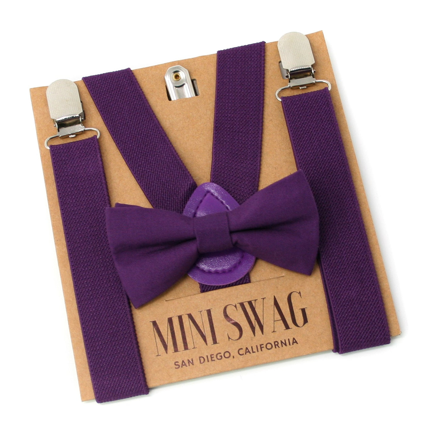 Plum Purple bow tie and suspenders set on a cardboard box with 'Mini Swag' branding.