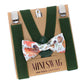 Green suspenders with a fall leaves bow tie on a cardboard backing, featuring 'Mini Swag' branding.