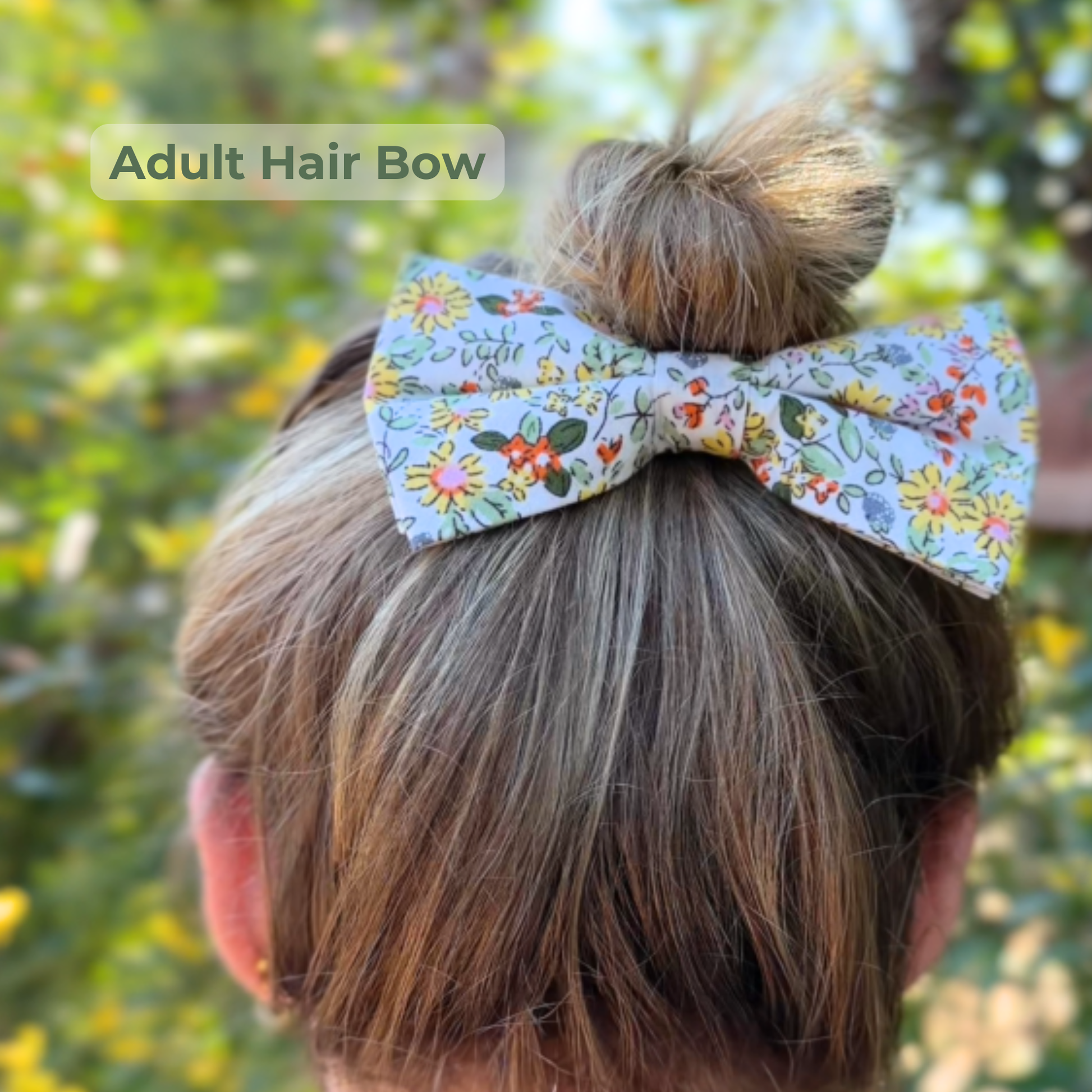 Spring floral yellow adult hair bow in woman’s hair