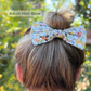 Spring floral yellow adult hair bow in woman’s hair