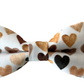 heart bow tie in shades of brown on white background