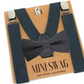Dark gray  suspenders and bow tie set on a 'Mini Swag' branded card.