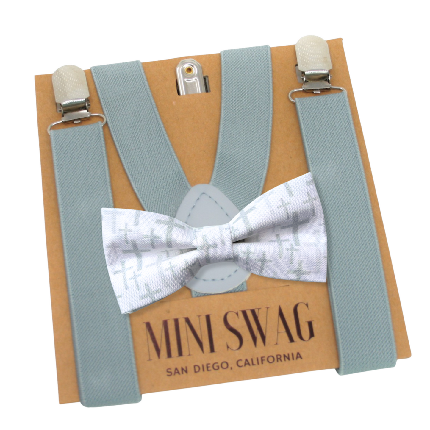 grey blue suspenders with a christian cross white bow tie on a Mini Swag branded card.