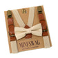 Beige bow tie and suspenders set on a 'Mini Swag' branded box with a white background.