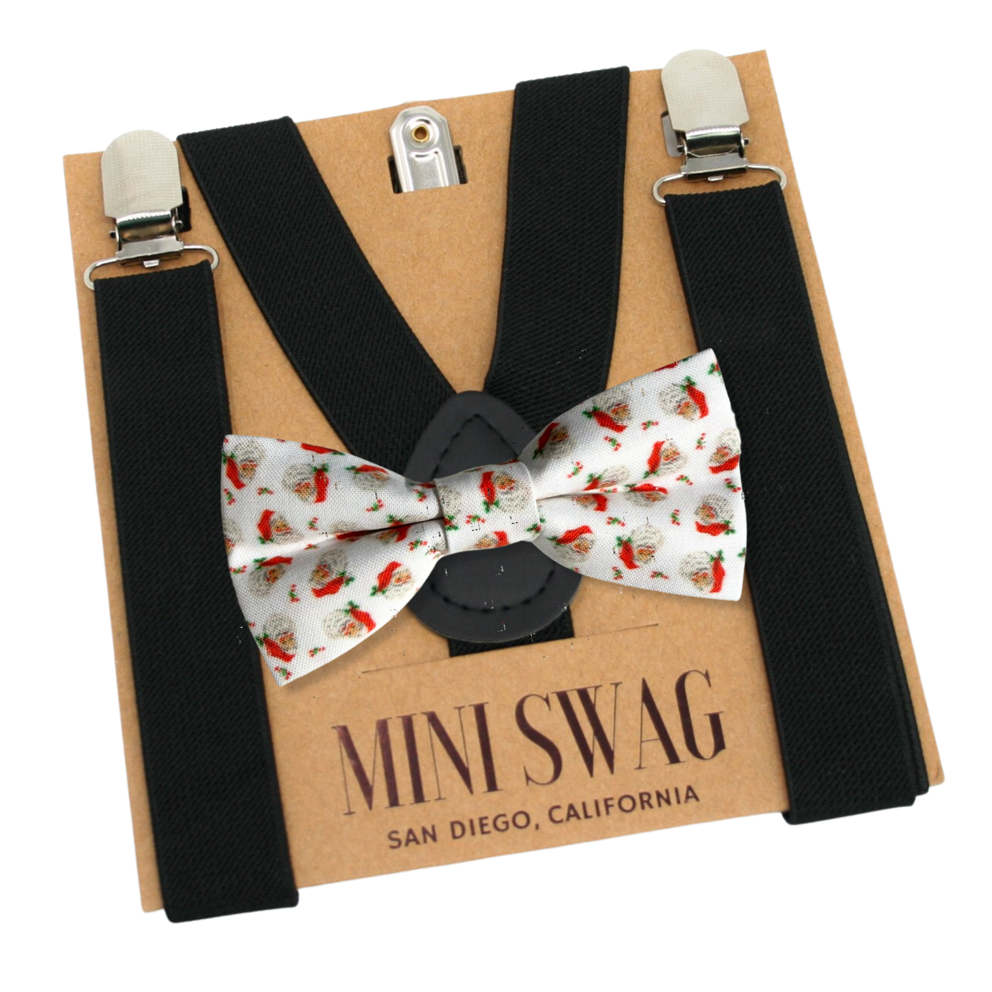 Black suspenders with a white bow tie featuring red and green patterns on a Mini Swag branded box.