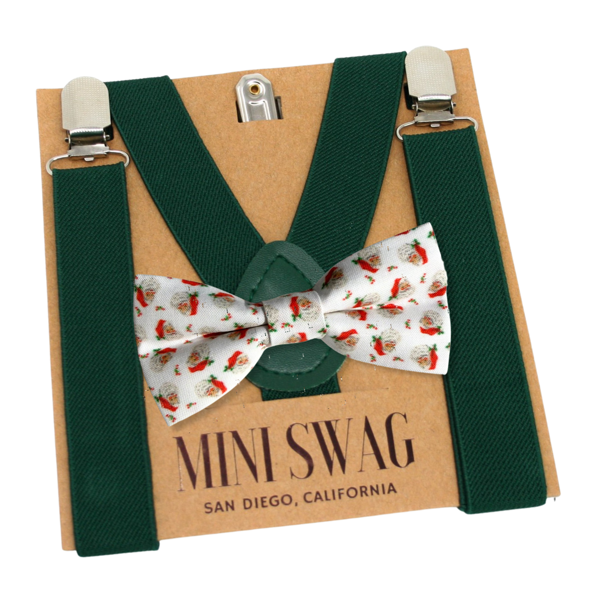 Green suspenders and patterned bow tie on a Mini Swag branded cardboard box.