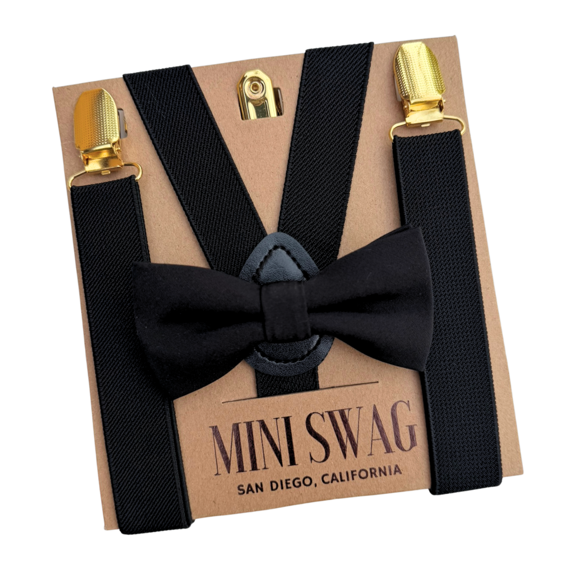 Black bow tie and suspenders set with gold clips on a 'Mini Swag' branded box.