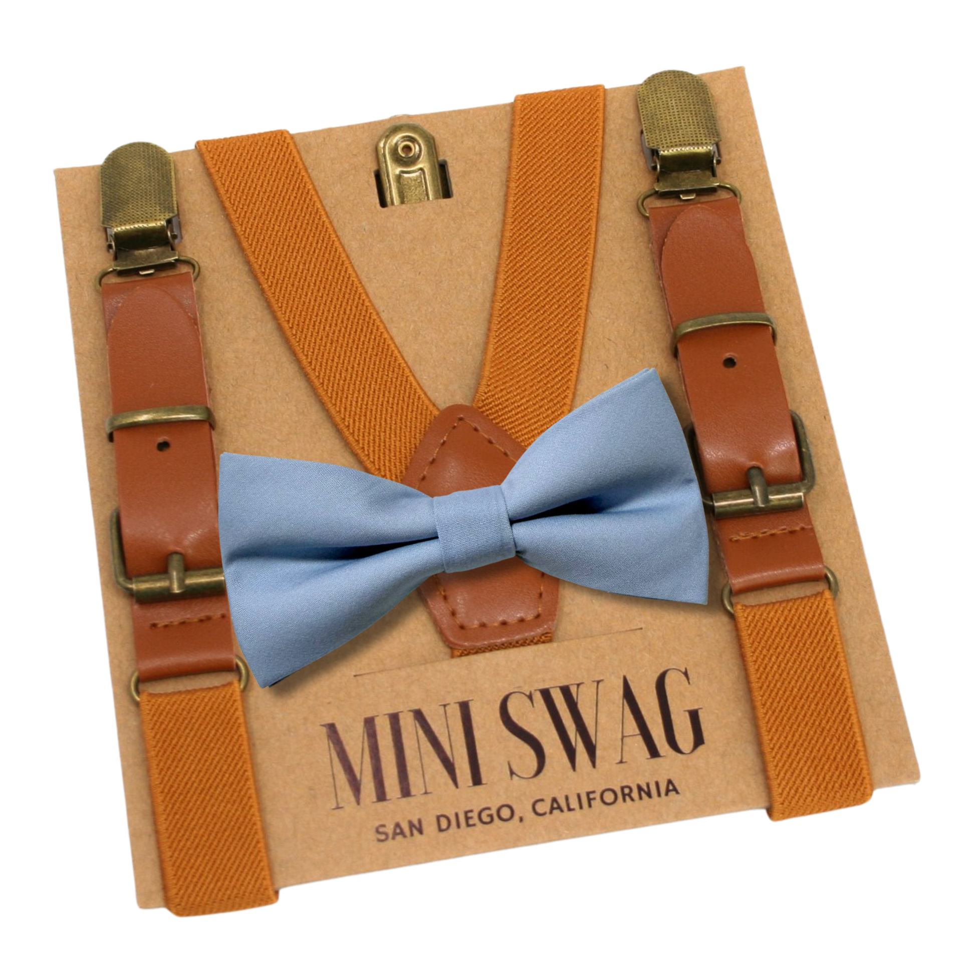 camel brown suspenders with a dusty blue bow tie on a 'Mini Swag' branded card.