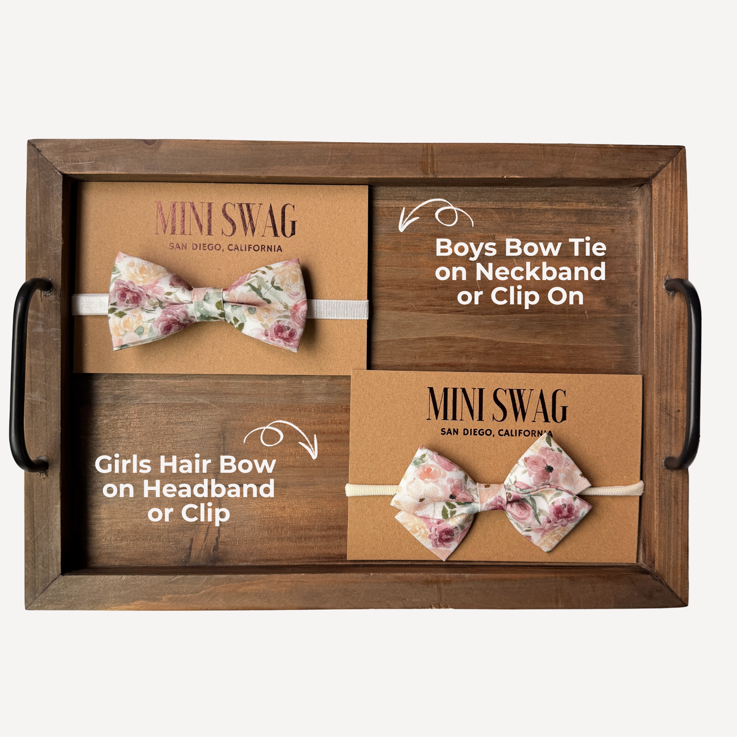 Wooden tray with floral bow ties and hair bows on a white background