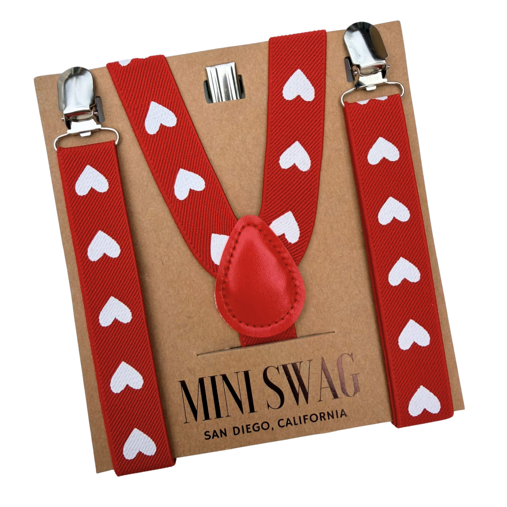 Red suspenders with white heart patterns on a Mini Swag branded card.