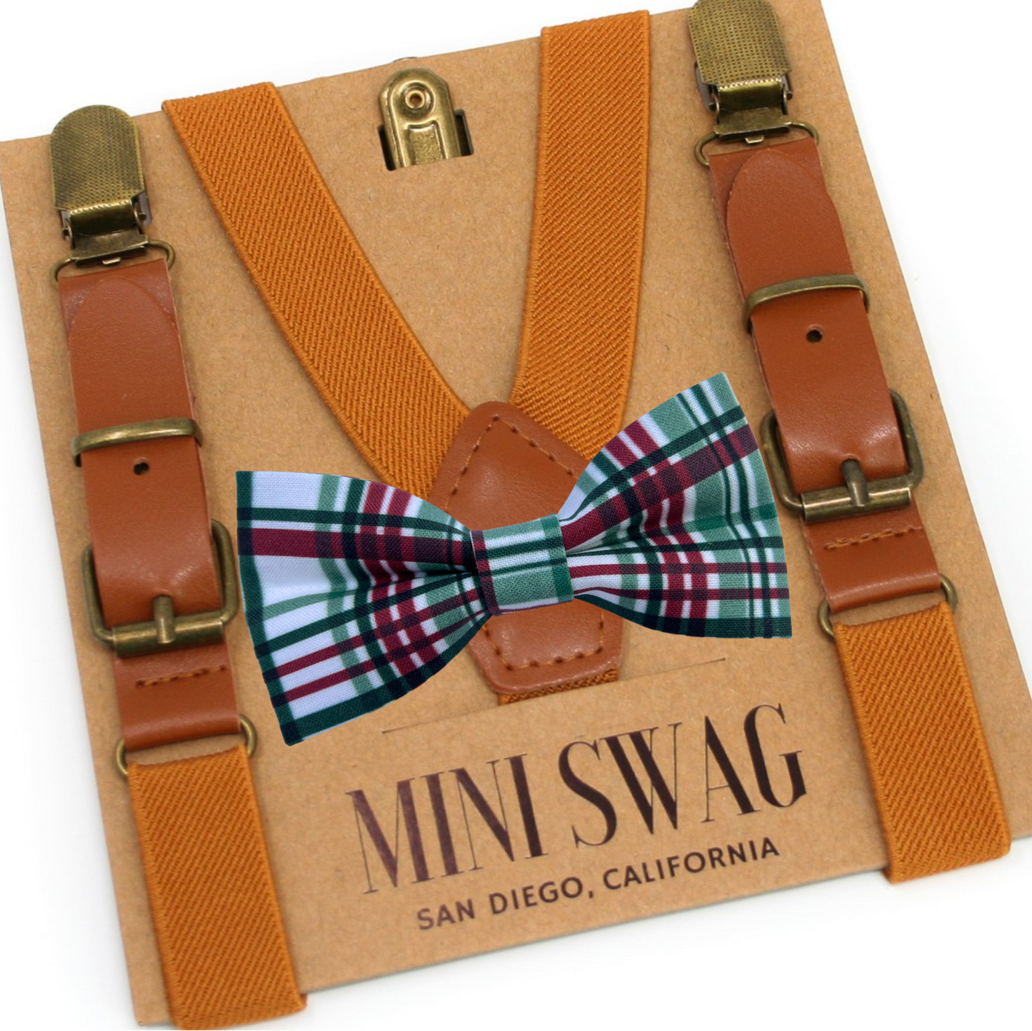 Suspenders and bow tie set with 'Mini Swag' branding on a cardboard backing.