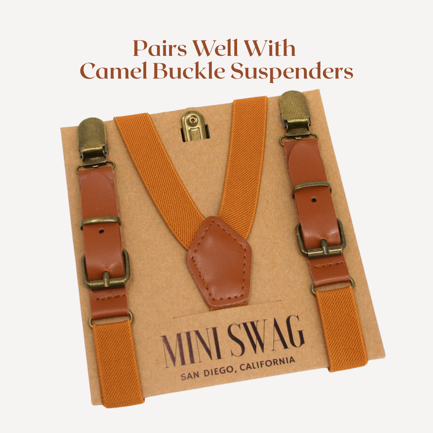 camel suspenders with brown leather straps on a cardboard backing, featuring 'Mini Swag' branding.