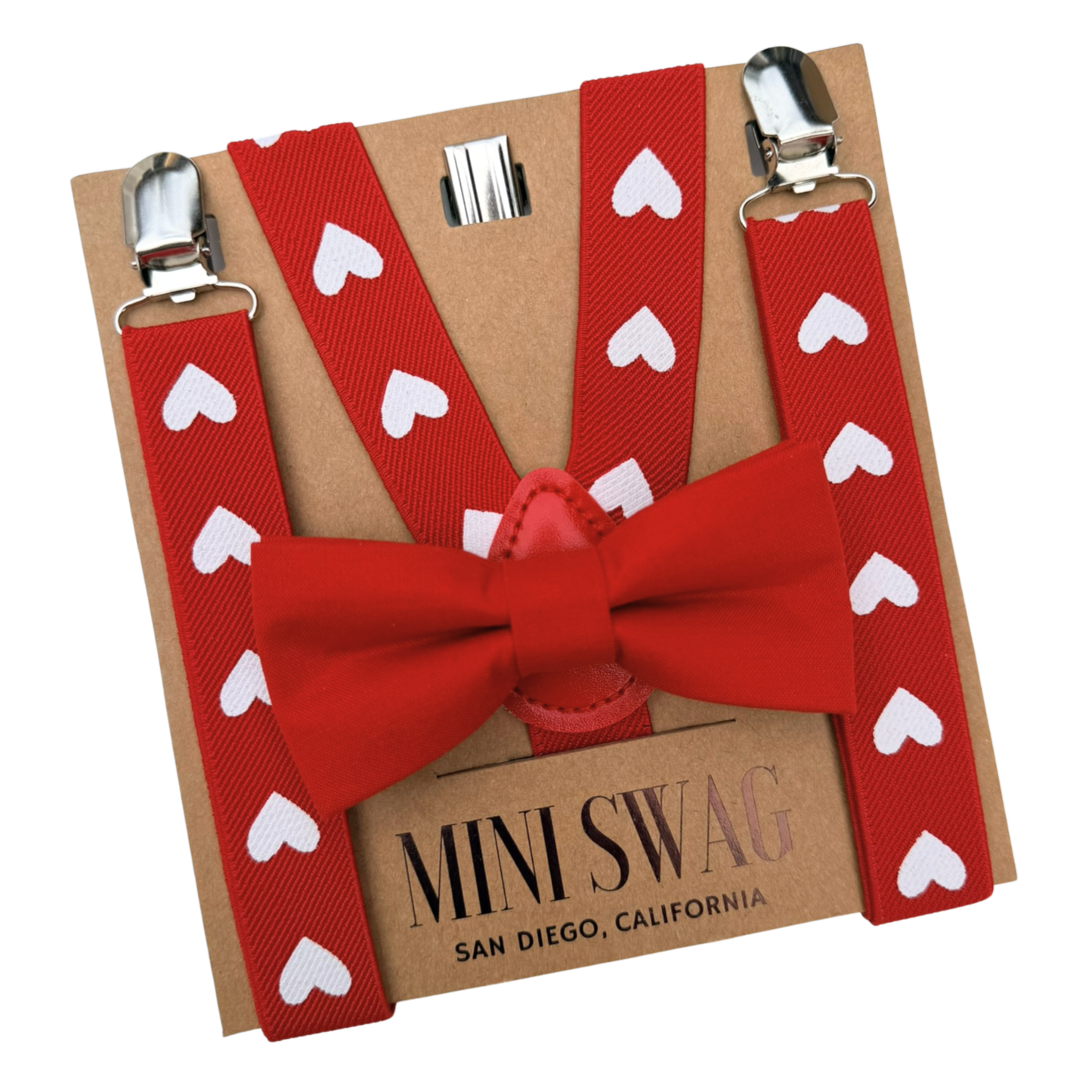 Red bow tie and suspenders with heart patterns on a Mini Swag branded card.