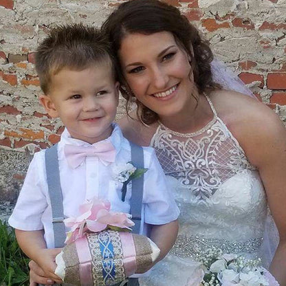 a woman and a boy dressed up for a wedding