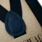 Black suspenders with matching black patch