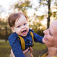 a woman holding a baby in her arms